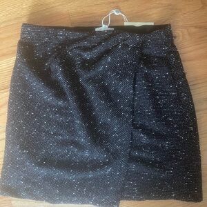 Black and white mini skirt. Some pleads on the left side ..